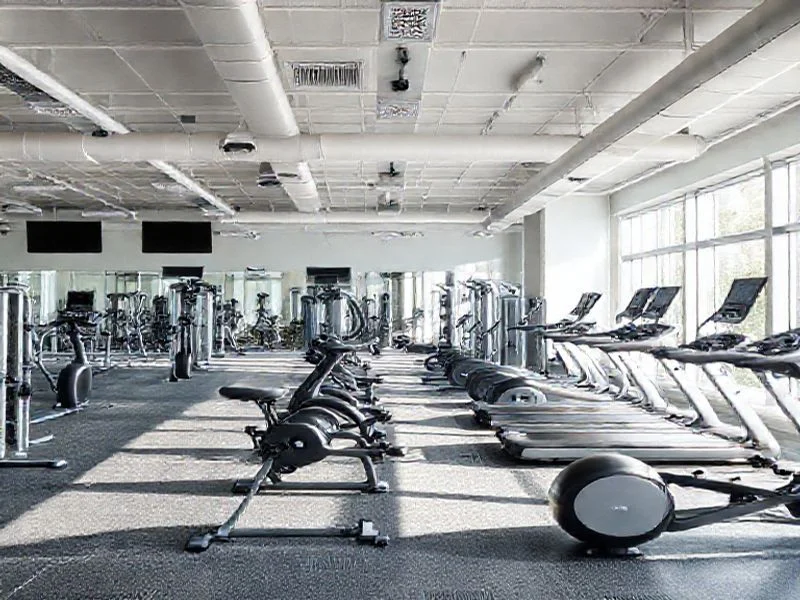 An abstract close-up shot of a complex, interwoven geometric structure, resembling interlocking gears or finely-tuned mechanical components made from brushed titanium and carbon fiber. Subtle blue and teal light reflects off the metallic surfaces, creating a sense of precision, complexity, and hidden power. The image evokes engineering integrity and foundational principles.